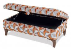 Pictured in the exclusive Savannah ottoman shown with Walnut legs - pictured in a dis-continued fabric 