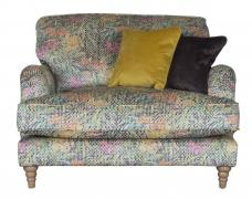 Pictured in Courture Multi (no longer available as a main fabric cover), scatters cushions in Jedi Mustard and Sublime Asphalt with Limed Oak Turned legs