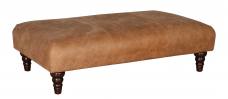 Buoyant Beatrix Legged footstool shown in Capri Tan leather 