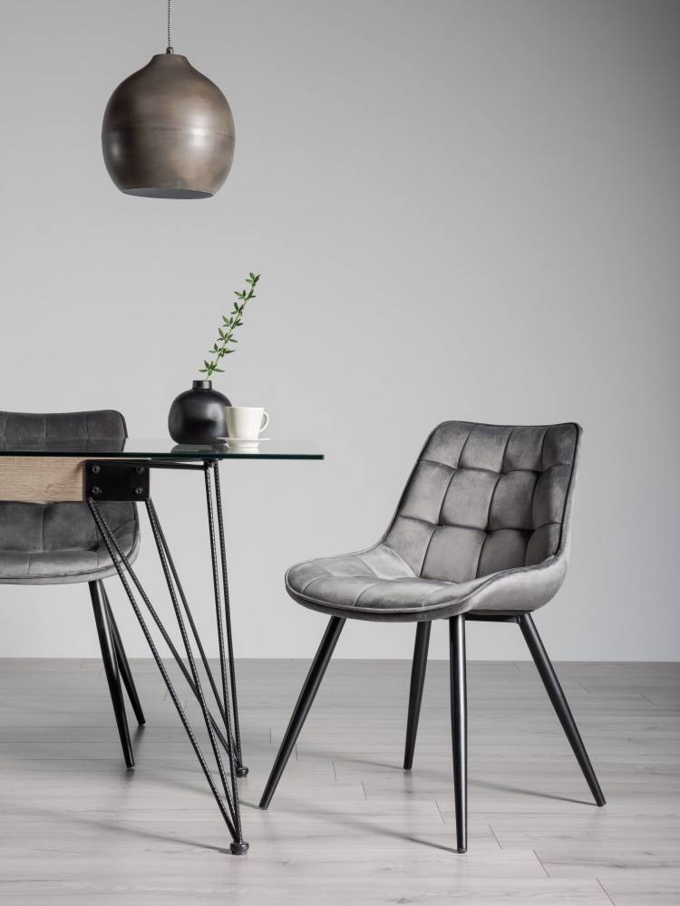 The Bentley Designs Seurat Grey Velvet Fabric Chairs on Display