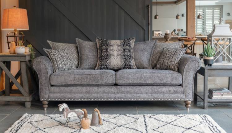 Pictured in fabric 2917 (Band B), 2 pillows in 2137, 2 pillows in 2917, 1 pillow in 2367, small scatter cushions in 2277, antique ash / brushed nickel legs. Item shown with optional pewter studding.